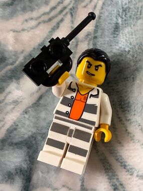 Lego Yellow Minifigure with Black Hair and White/Gray Striped Prison Outfit